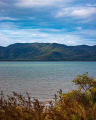 Fototapeta na wymiar panorama of cape pallarenda in townsville with the view of magnetic island in the background; unique coastline of north queensland, australia