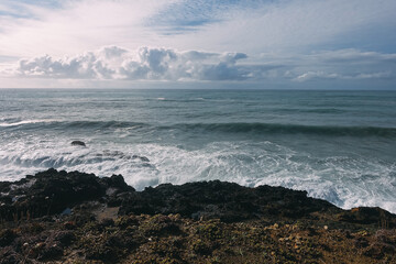 black sand beach with footprints concept follow the path