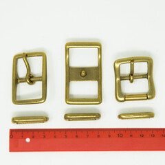 A collection of metal fittings used for leather products