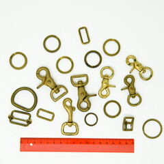 A collection of metal fittings used for leather products