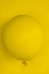 a simple balloon in the background with the same yellow tone, placed in the center and cut vertically