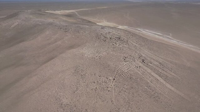 Tarapaca Giant its a large petroglyph on a rocky outcrop in the Atacama Desert, Tarapaca Region, northern Chile. It was created by native indigenous people of Chile in the year 900.
