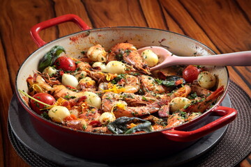 Prawns Provençal style, fried prawns with onions, basil, garlic and pepper