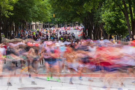 Motion blur of thousands running in Atlanta Peachtree Road Race
