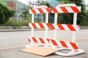 Vibrant construction cone amidst urban chaos signifies progress, safety, roadwork, caution, and...