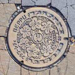 Beppu, Japan - Nov 25 2022: A beautiful manhole coverin Beppu city, Oita prefecture