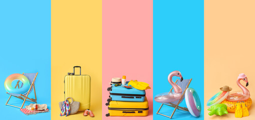 Set of beach accessories with packed suitcases on color background