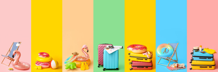 Collection of beach accessories with packed suitcases on color background