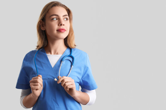 Female intern on grey background