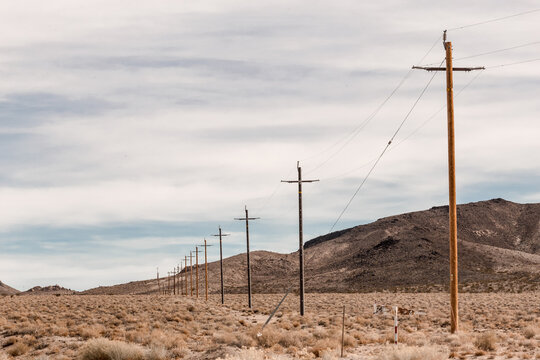 Old electricity poles in the desert landscape