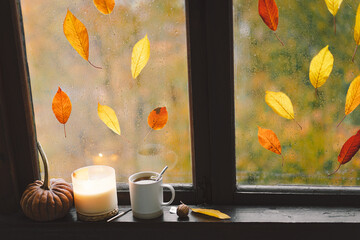 Naklejka na ściany i meble Sweet Home. Still life details in home on a wooden window. Sweater, candle, hot tea and autumn decor. Autumn home decor. Cozy fall mood. Thanksgiving. Halloween. Cozy autumn or winter concept.