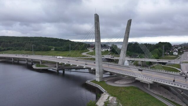 Farrisbrua Bridge With Cars Traveling In Larvik, Norway On A Cloudy Day - aerial drone shot