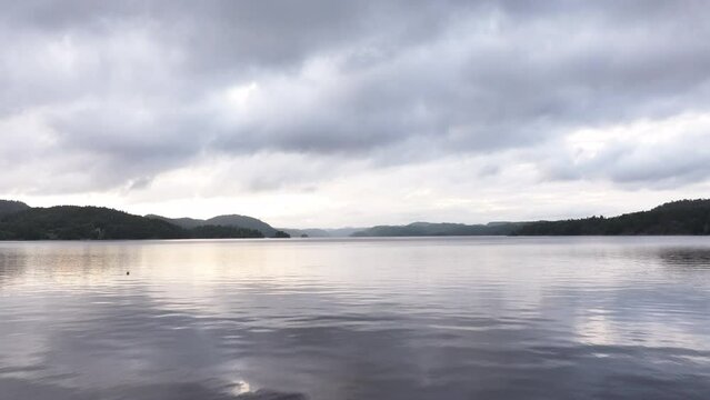 Flying Over Farris Lake On A Cloudy Day In Norway - aerial drone shot
