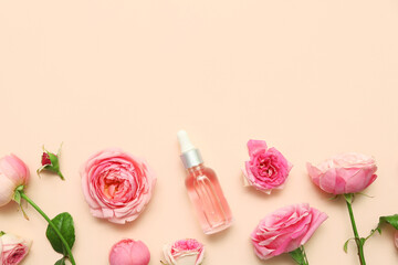 Bottle of cosmetic oil with rose extract and flowers on beige background