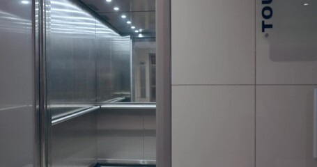 Elevator exit, floor and business people busy in an office for corporate or professional work. Lift, door and a group of employees, colleagues or coworkers in the lobby of a company workplace