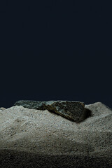 bottle container on a sand rock