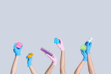 Female doctor's hands with pill boxes on grey background