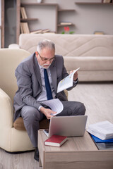 Old male boss working from home during pandemic