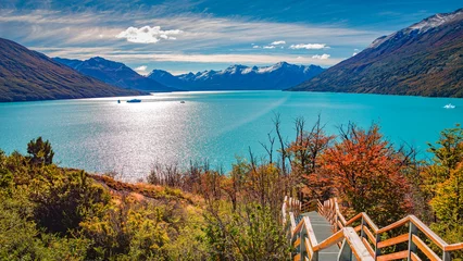 Foto auf Acrylglas Panoramic over Lago Argentino and walking path, near Perito Moreno glacier in Patagonia with blue sky and turquoise water, South America, Argentina, in Autumn colors © neurobite