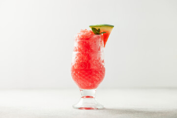 Refreshing cold summer drink watermelon slushie with mint in glass