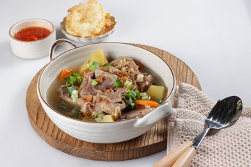 Sop Buntut or Sup Buntut is Indonesian Oxtail Soup with Carrot, Potato and Spring Onions.