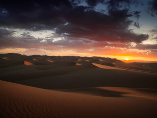 Fototapeta na wymiar beautiful desert landscape with a dramatic sunset sky