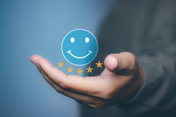 Man hand holding happy smile face positive mindset selection for feedback review satisfaction service. rating very impressed. Best quality. Customer satisfaction experience concept. copy space.