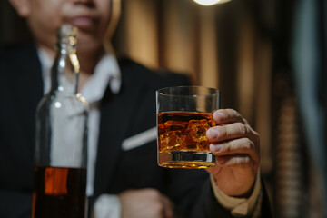 Barman pouring whiskey whiskey glass beautiful night