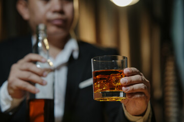 Barman pouring whiskey whiskey glass beautiful night