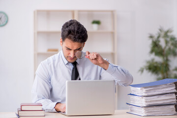 Young male employee working in the office