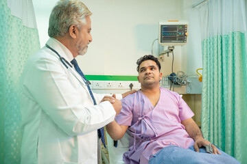 Doctor checking patient at hospital.