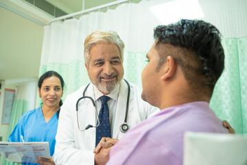 Doctor helping and support to patient while medical examination. trust and ethic concept.