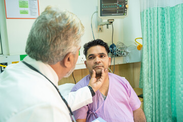 Doctor checking patient at hospital.