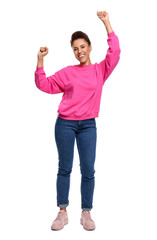 Happy young woman dancing on white background