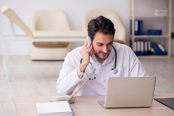 Young male doctor in telemedicine concept