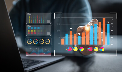 Analyst working with business analytics and data management system on computer, make a report with KPI and metrics connected to database. Corporate strategy for finance, operations, sales, marketing