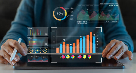 Analyst working with business analytics and data management system on computer, make a report with KPI and metrics connected to database. Corporate strategy for finance, operations, sales, marketing