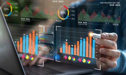 Analyst working with business analytics and data management system on computer, make a report with KPI and metrics connected to database. Corporate strategy for finance, operations, sales, marketing