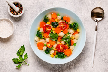 Soup with mini dumplings and vegetables.