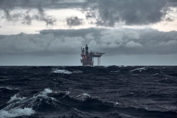 Jack up oil rig in stormy weather in the Sea.