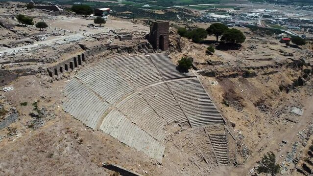 Circle drone shot of Pergamon Greek Theater in Bergama Turkey on top of the hill