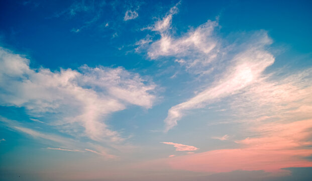 Clouds twilight sky in pastel color Pink and blue, colorful spiritual background.