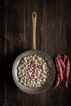 Cranberry beans. Borlotti beans in bowl. Beans pods.