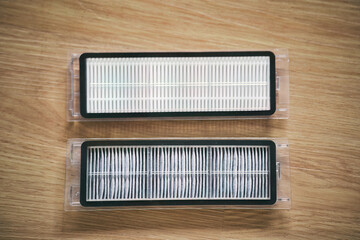 Mop and HEPA dust filter replacement for robot vacuum cleaner. Duster spare parts replace. Modern housekeeping accessories concept.