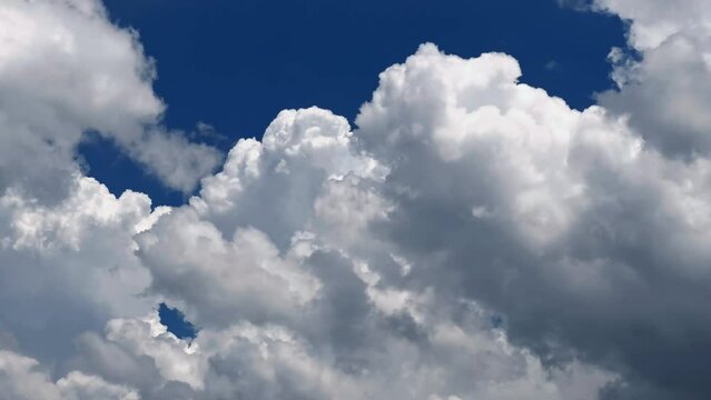 Cumulonimbus clouds drifting and rising up in the blue sky.  Cloudscape, Japan