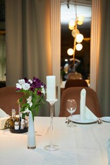 The light is also in the candlesticks on the festive table. Interior decoration