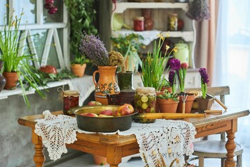 Rustic kitchen and blanks on the table. Interior decor. Fruits and cans of vegetables. Spring flowers