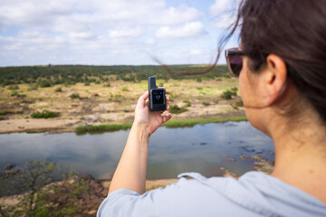 Outdoor Girl with GPS Satellite Device in the Wilderness
