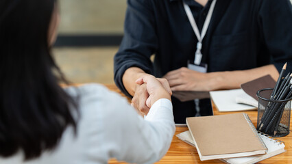 Business man and woman handshaking partner business handshake agreement cooperation