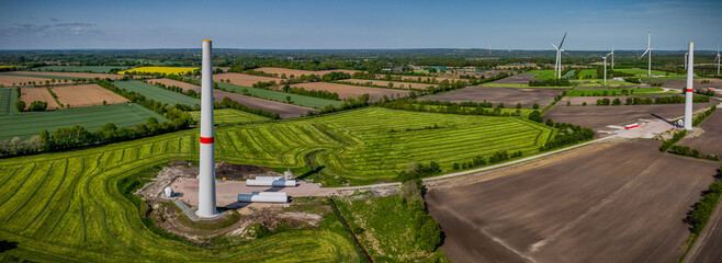 Panorama view  on construction site of wind energy plant between agriculture fields. Construction...
